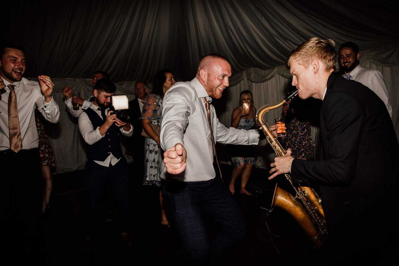 The best dj and saxophone wedding duo getting people dancing at wedding